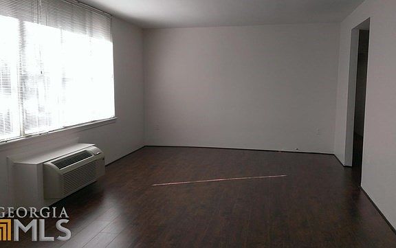 Large living room with huge window display for natural light.