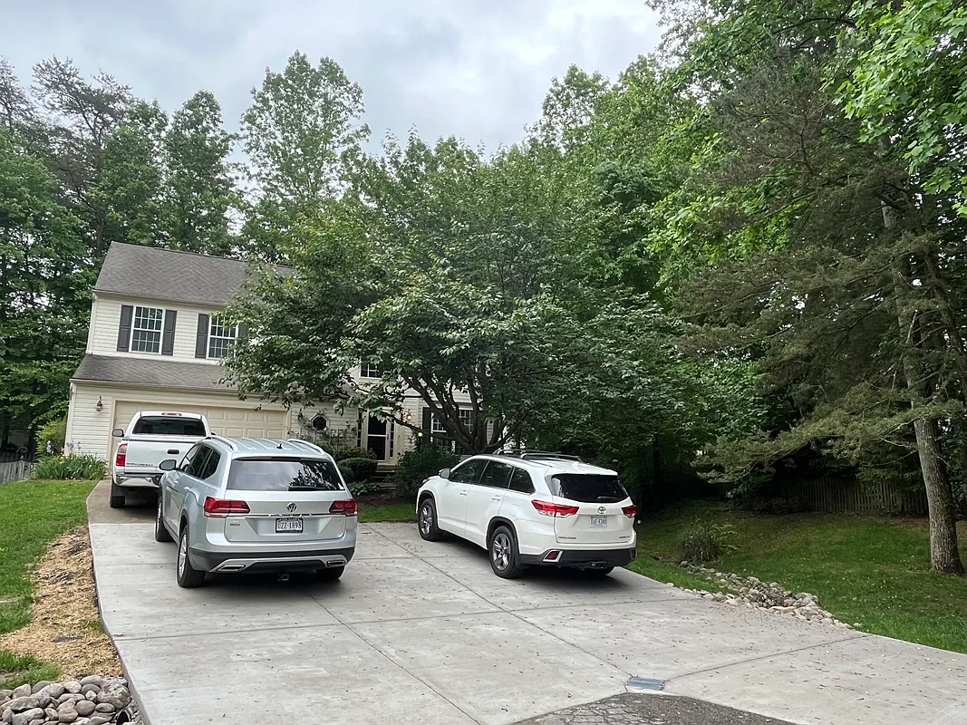 Wide concrete driveway with room for multiple vehicles _ important when you're hosting family or coordinating multiple commutes to Quantico and the Pentagon. - 4353 Glastonbury Ct