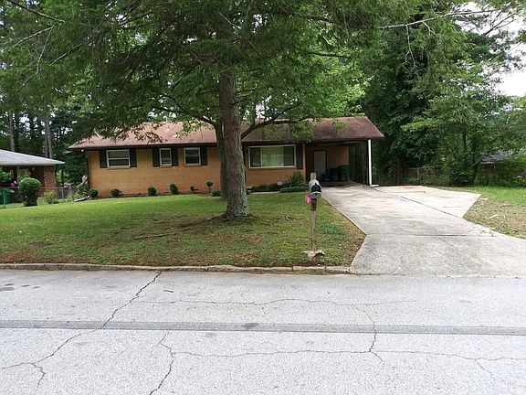 Carport and large driveway