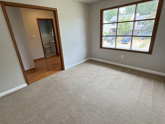 Front room with bay window and brand new 52" ceiling fan. Is this going to be your office, playroom, study? You decide!