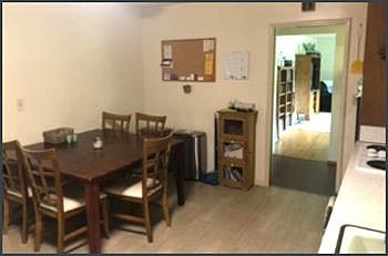 Dine-in kitchen. View of living room through the door and across the entry hallway.