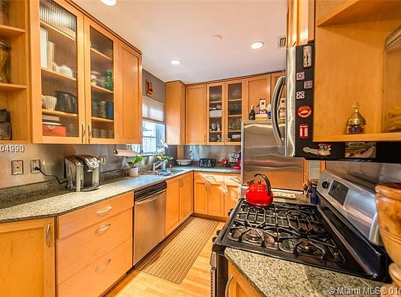 Charming bungalow on a quiet, tree-lined, cul-de-sac street in prestigious North Coconut Grove