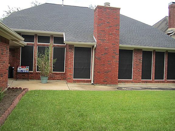 Back yard view. House and garage all bricks around (4 sizes bricks)  for easy to maintain.