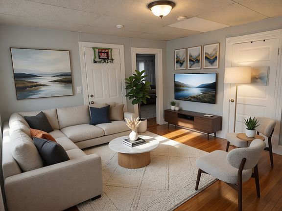 Living Room - Virtually staged to highlight the room's ideal layout and functionality.