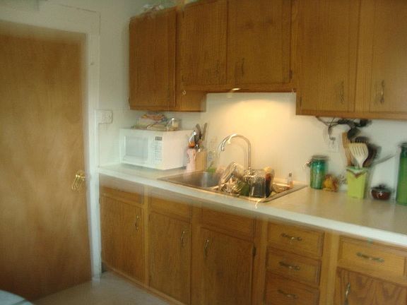 Kitchen, new countertop added.  It's black and looks much ni