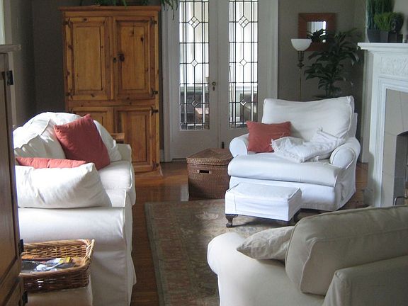 LR with wood-burning fireplace insert, hardwood floors