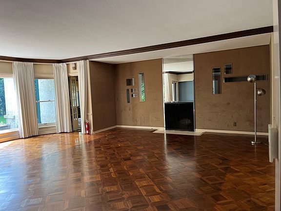 Formal Living Room with access to den, dining room, formal entry.