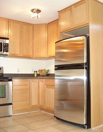 Kitchen includes all brand new stainless steel appliances; range/oven with an overhead microwave, re