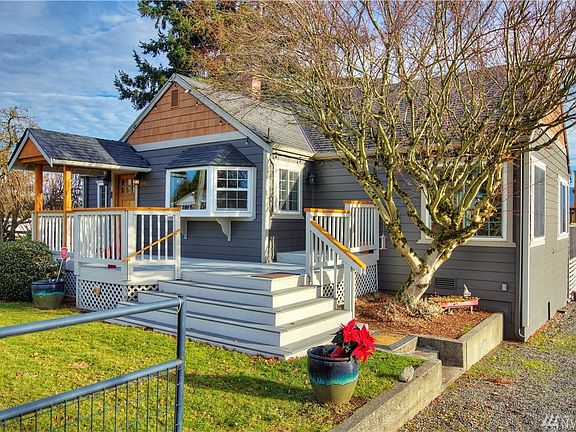 New Trex front porch welcomes you to this charming farmhouse! 