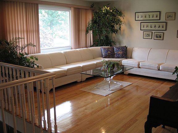 Beautiful, spacious living room with #1 Oak hardwood floors on the upper level