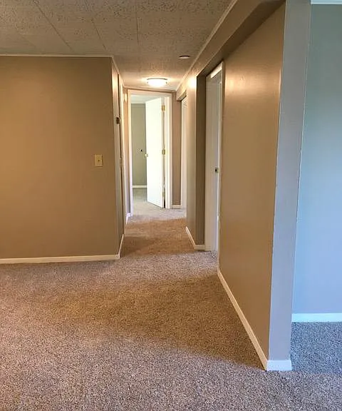 Hallway (Dining Room on the left, Living Room on the right, Bathroom and Bedrooms beyond)