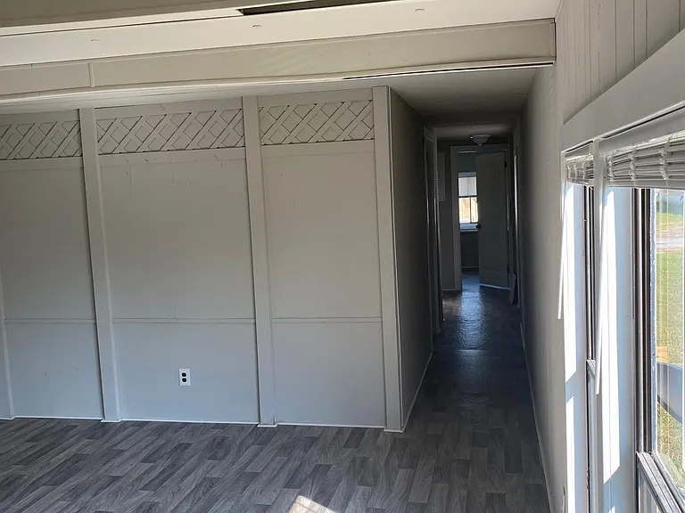 Living room and hallway to bedrooms and bath