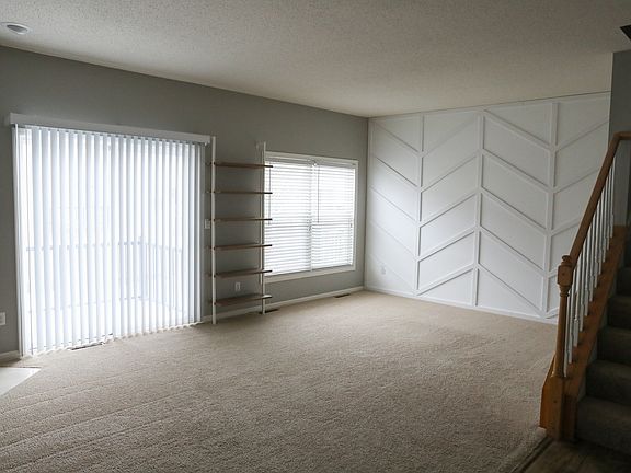 Living Room + Doors to Deck + Stairs to the Upstairs
