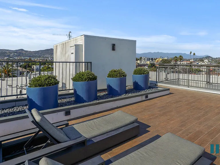 Rooftop Terrace with Lounge Chairs and Views of the City