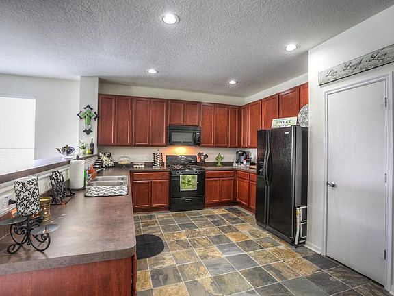Lots of counter space and rich warm colors in the kitchen