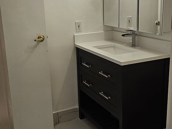 Update Jack and Jill 1.5 Bathrooms with luxury tiles, luxury vanities with built in shelves and glass medical cabinet