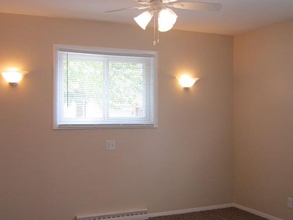 Bedrooms have windows and nice light fixtures.
