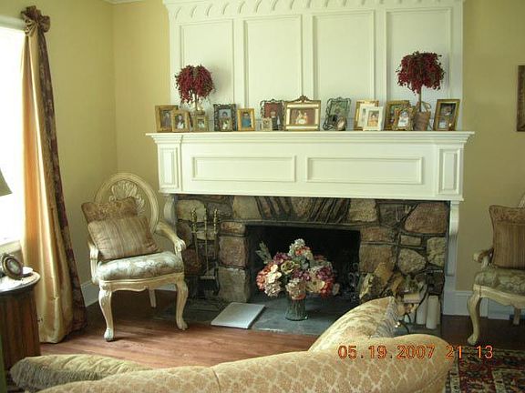 Sitting Room off Fml Dining Room has woodburning FP w/custom mantle