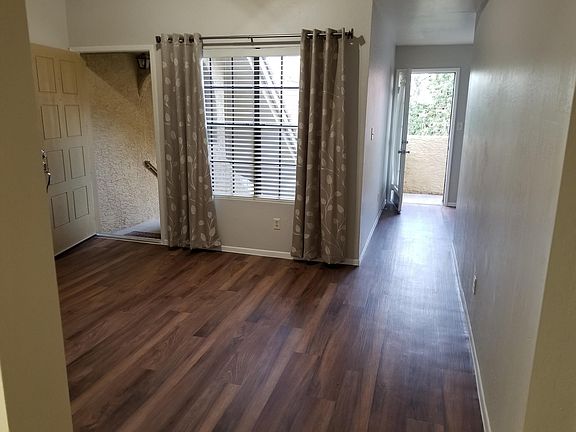 Front door with hall leading to bonus room.