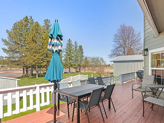 A new deck will replace this one pictured here. Enjoy sunsets and BBQs right off your kitchen with easy access to the grassy, level waterfront lawn.