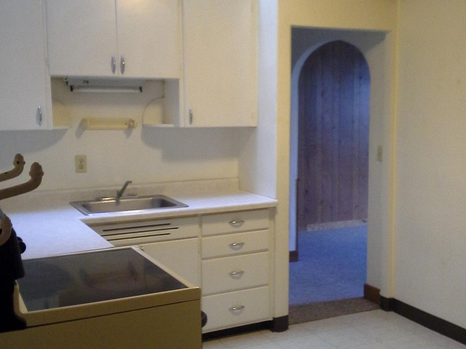 Kitchen features antique skylight and lots of storage.