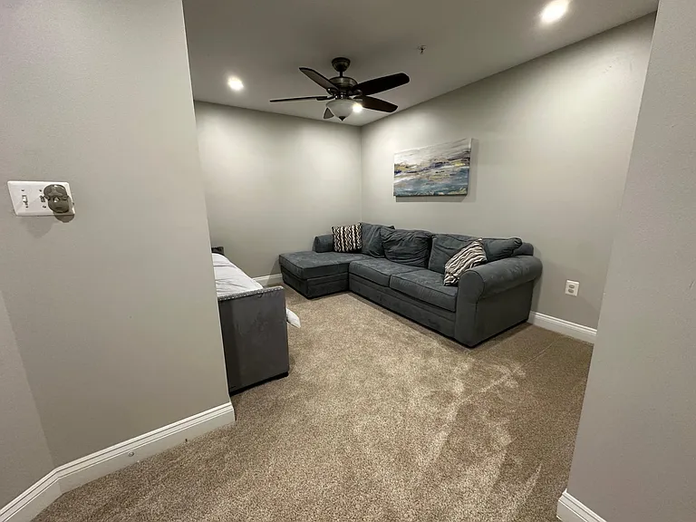 Second floor contains two guest bedrooms, den, one full bathroom,