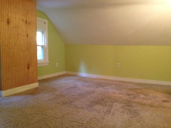 Partial view of one of the bonus rooms. Other bonus room is same size. Paint is now white in both rooms.