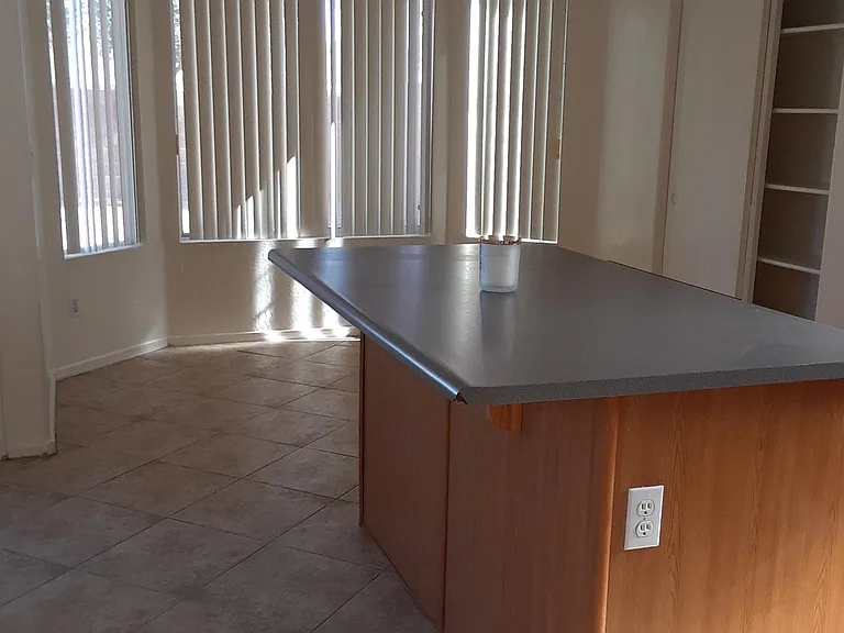 The kitchen island,pantry and dining area