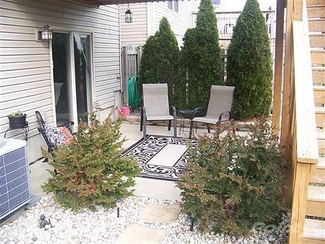 Patio under deck from family room makes a nice oasis on a hot summer day....large fenced yard