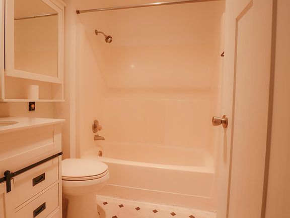 Full bath and shower combo in the upstairs bath.