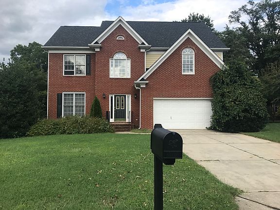 Big home with lush trees