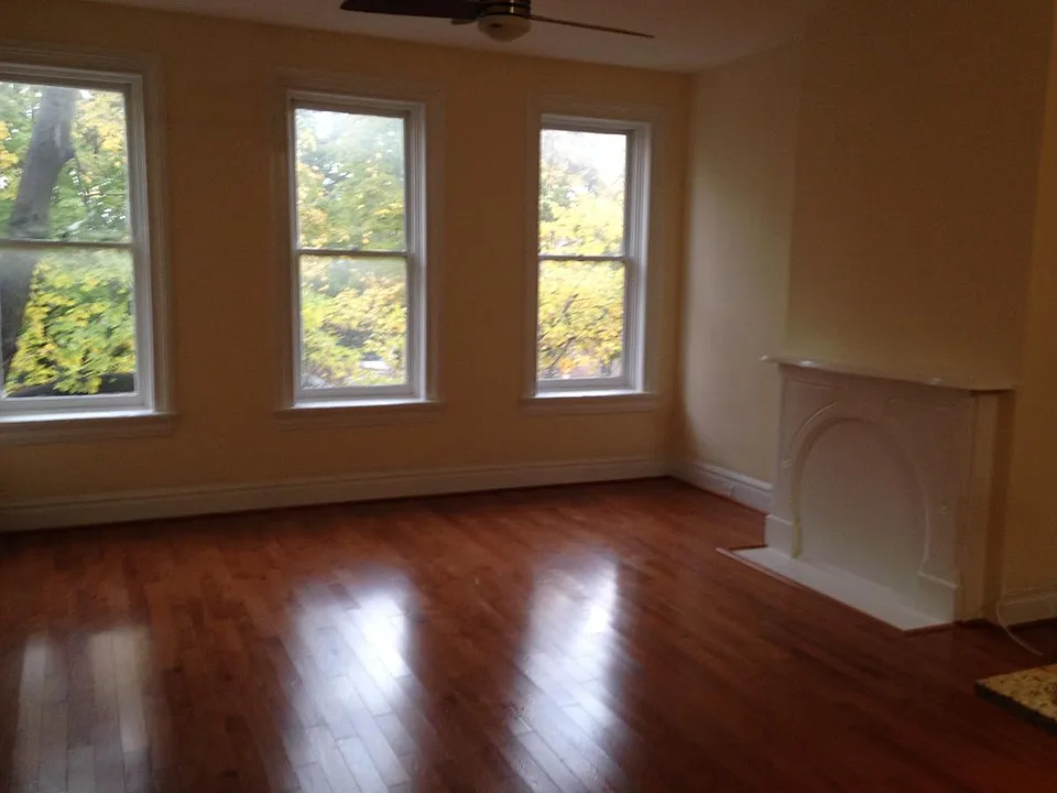Great room with view of windows and mantle