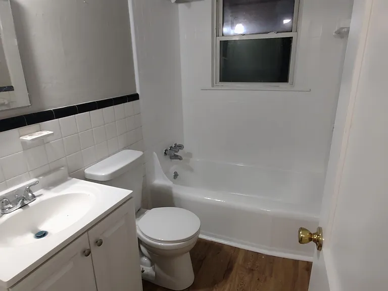 New bathroom vanity, flooring, medicine cabinet, reglazed tub