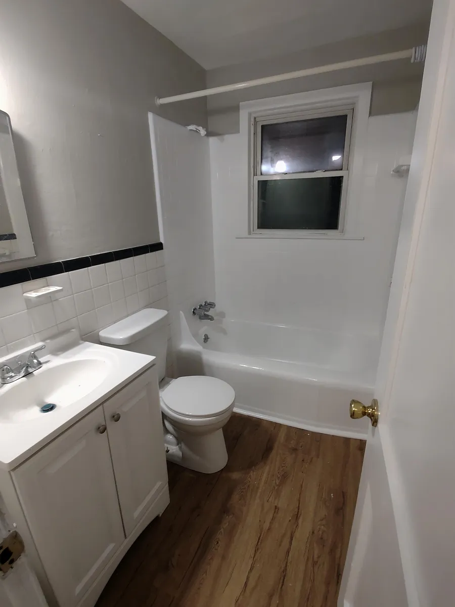 New bathroom vanity, flooring, medicine cabinet, reglazed tub - 1287 W Ocean View Ave #3