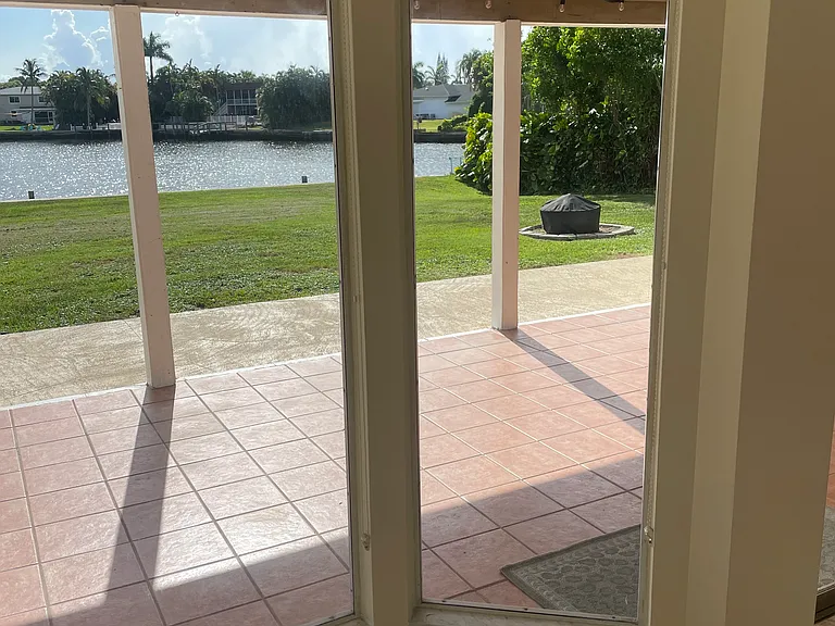 Another View from Breakfast Nook of Backyard and Patio