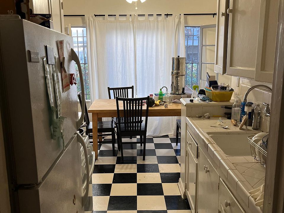 Kitchen of unit 102, comes with Refrigerator, Stove, Garbage Disposal, & Ceiling Fan