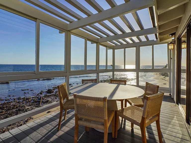 Savor al fresco meals with a BBQ grill and outdoor dining area.