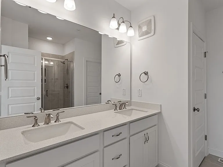 master bathroom with shower and closet