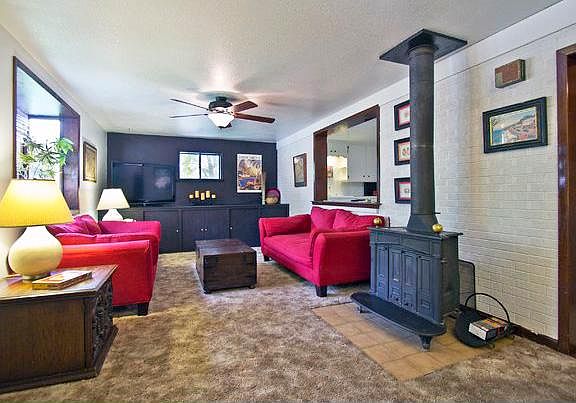 Family room with bay window and woodburning stove