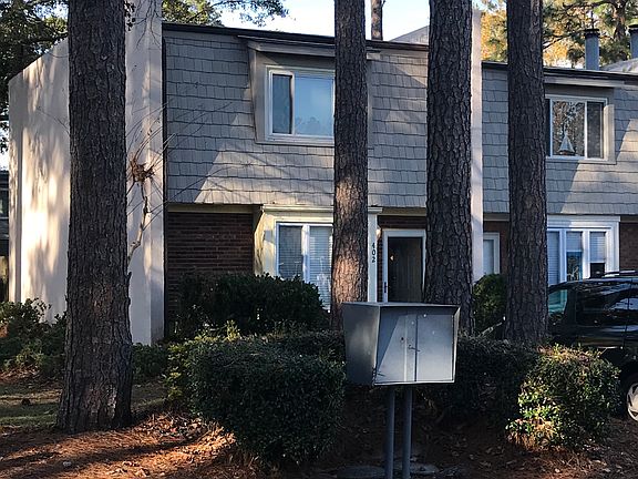 Shady parking, close mailbox
