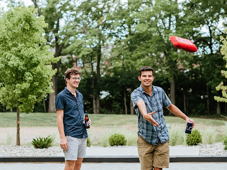 Outdoor courtyard with cornhole