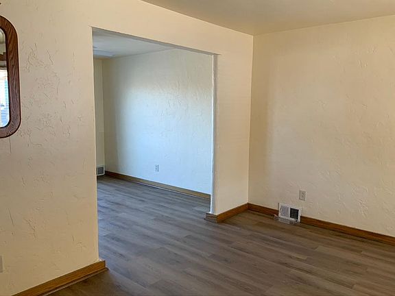 The living room connects to the dining room.