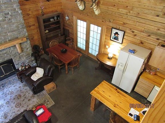 This view is from the balcony looking down toward the living room, breakfast bar & eat in area w/French Doors leading to the covered patio.