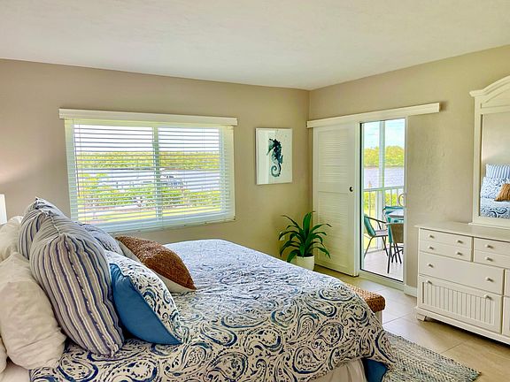 Water views from the en suite Master bedroom with direct access to Lanai