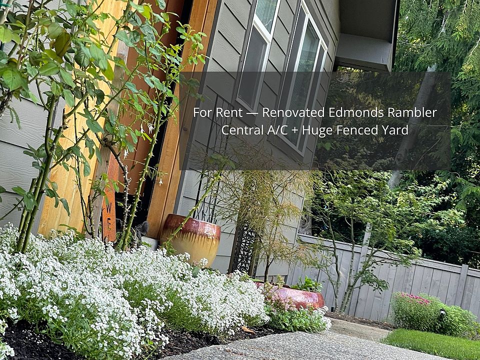 Welcome home to your private Edmonds retreat _ where modern design meets peaceful green surroundings.