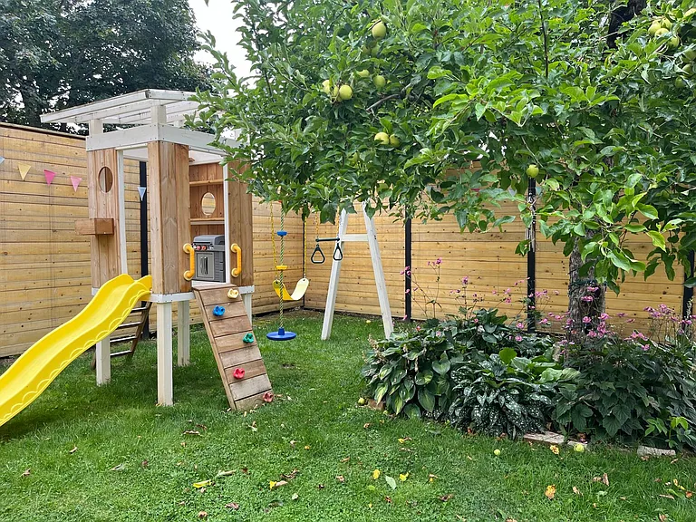 Golden Delicious apple tree and play house/swing set for your little ones.