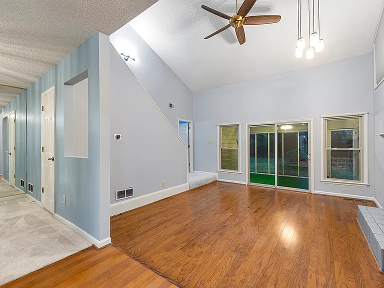 Living room downstairs, dining room on the left.