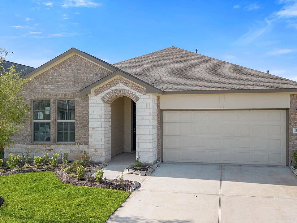 Welcome home to 27506 Clear Breeze Drive located in the master planned community of Sunterra and zon