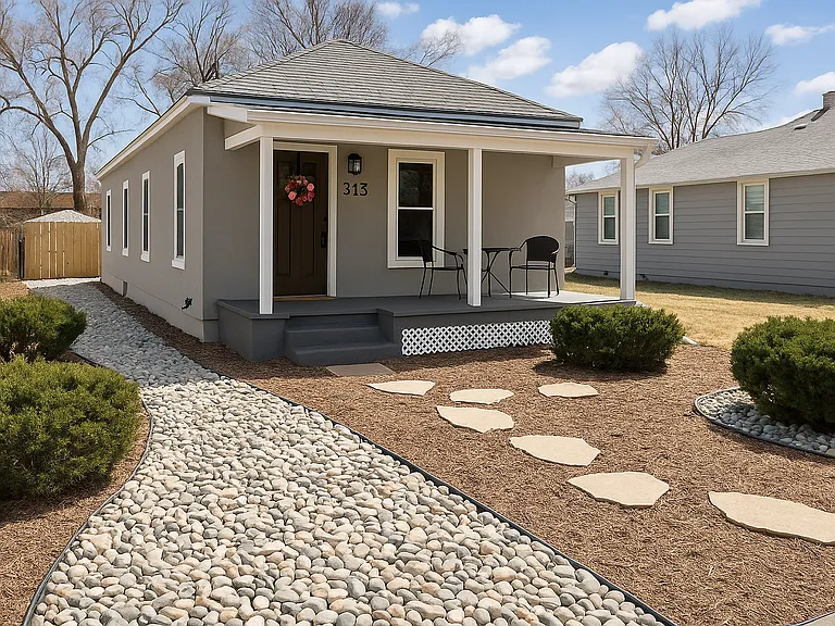 Charming exterior with a cute front porch_perfect for morning coffee or evening chats.