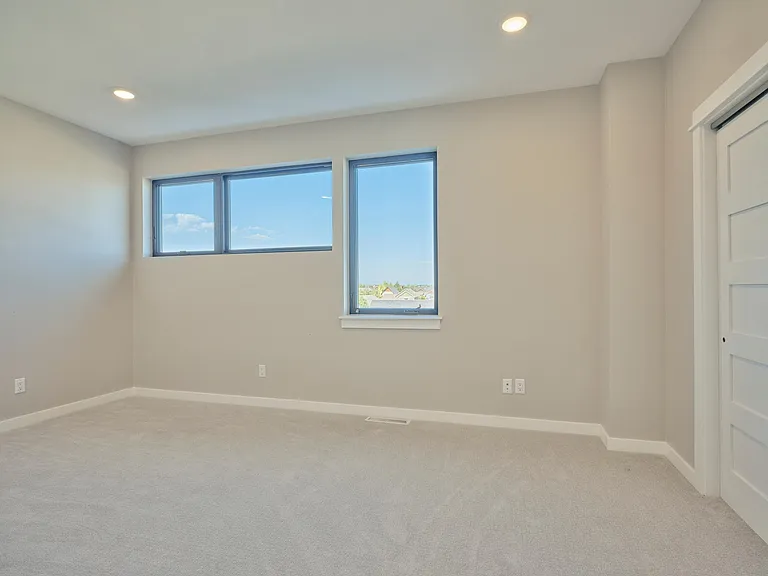 3rd level suite with private attached bathroom and two closets. Great views.